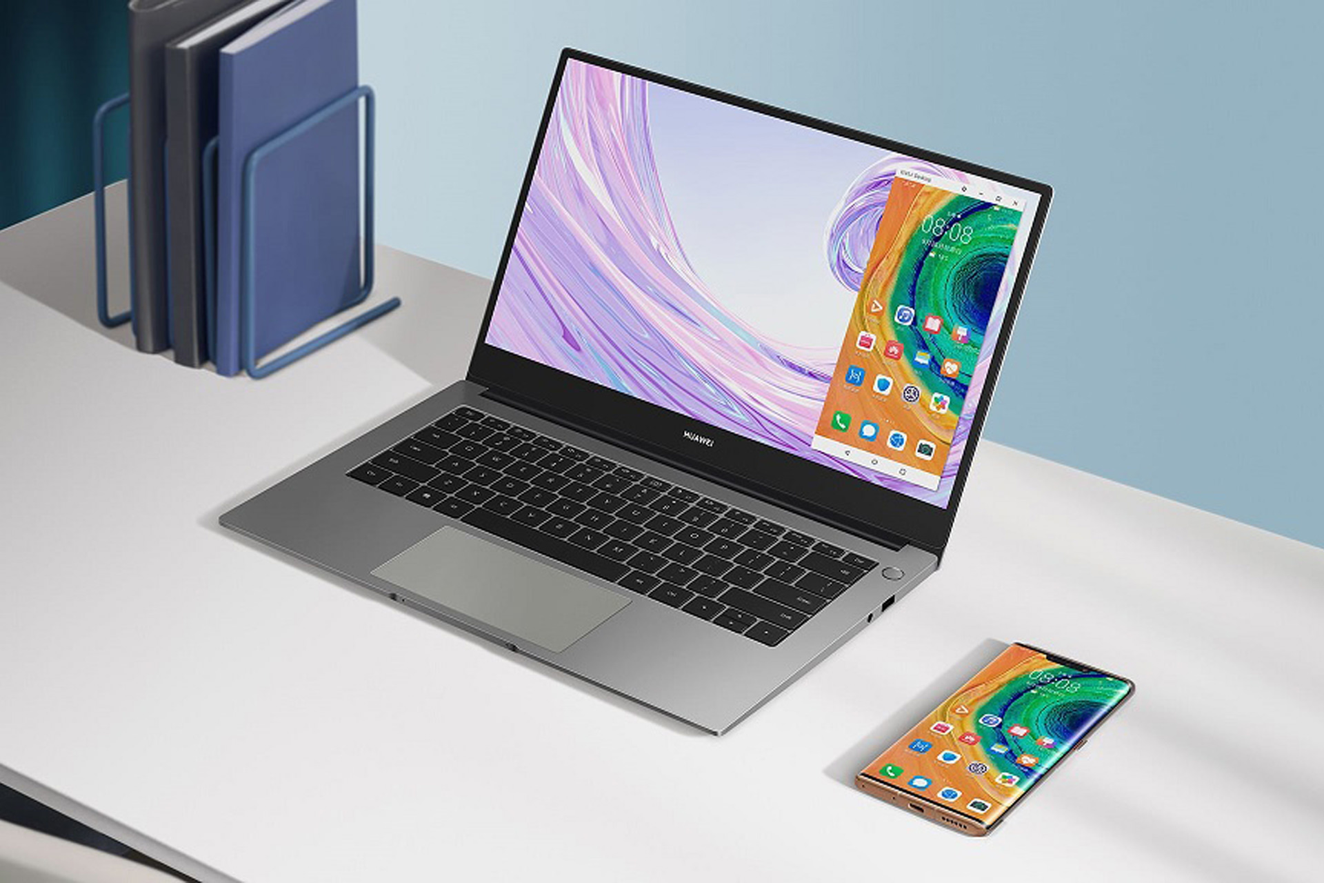 Huawei MateBook D14 on the table with the phone
