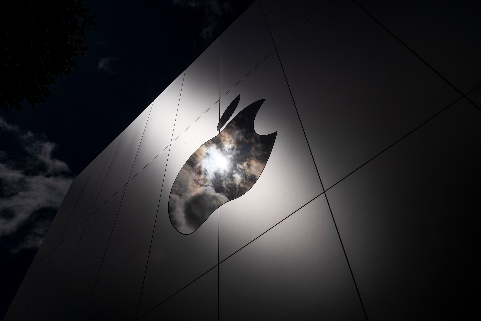 apple logo store building dark