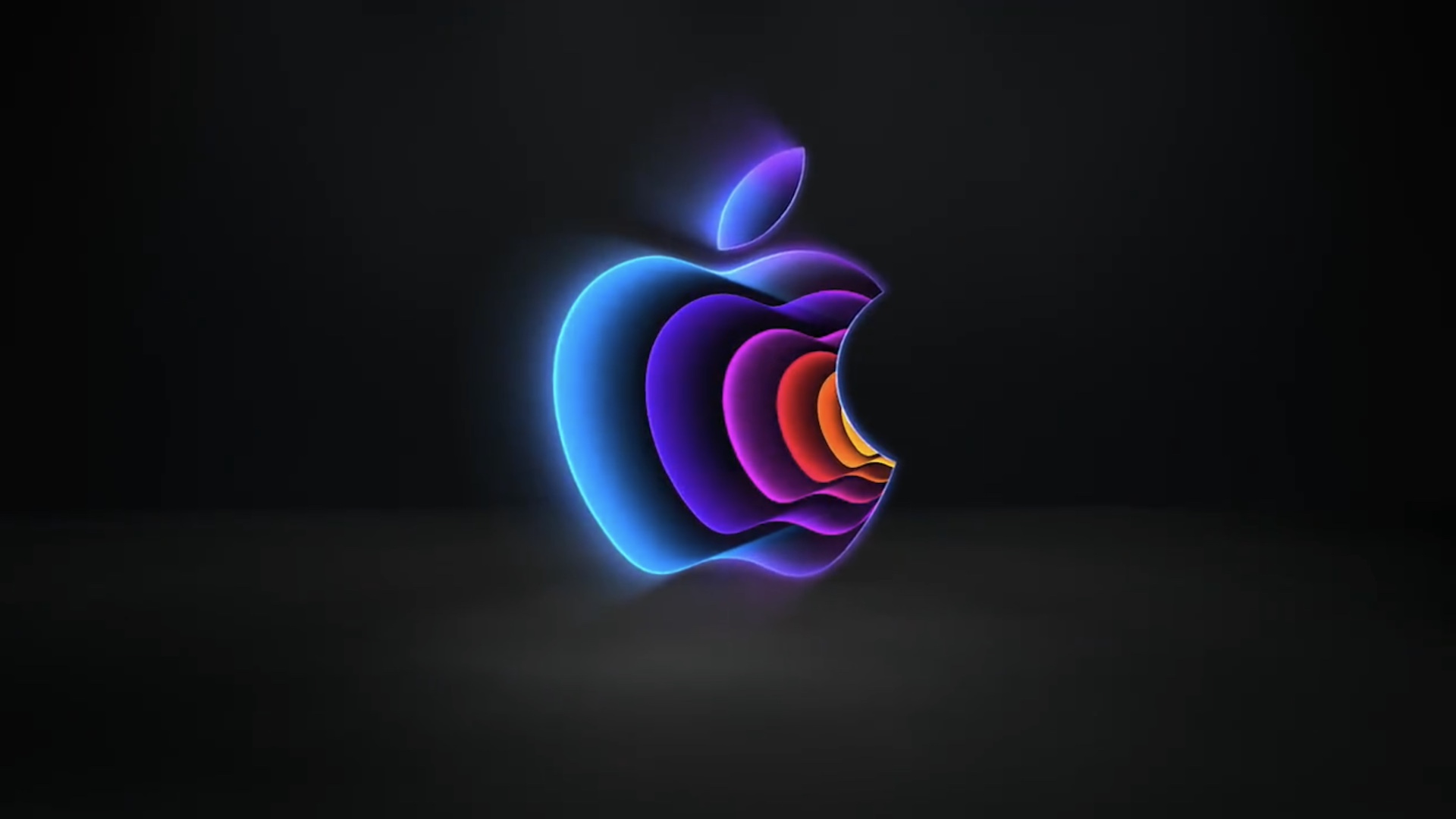 لوگو رنگین‌کمانی اپل در پس‌زمینه مشکی
